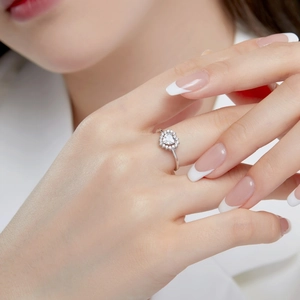 Close-up of elegant S925 silver ring featuring heart-shaped gemstone and micro-pave setting