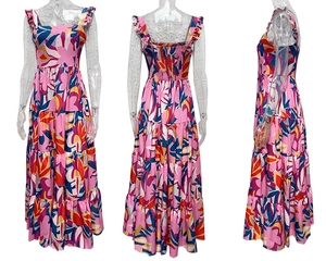 Detail of pink floral bohemian dress with square neck and tiered maxi skirt