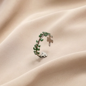 Adjustable silver titanium steel ring featuring green enamel vine leaves on silk
