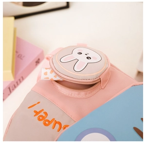 Close-up of a kids backpack featuring a cute rabbit pocket and super embroidery