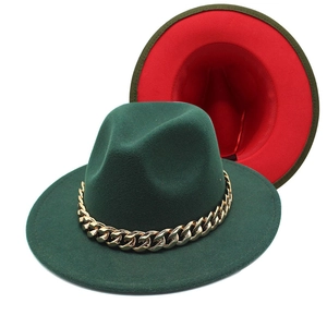 Detailed macro view of dark green fedora with gold chain and contrasting red lining