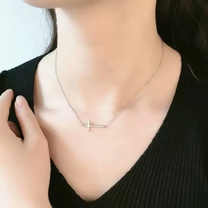 Elegant silver cross pendant choker necklace on a minimalist chain for women