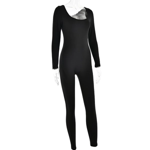 Detail view of the black high-elastic long-sleeve bodysuit with U-neck on transparent model