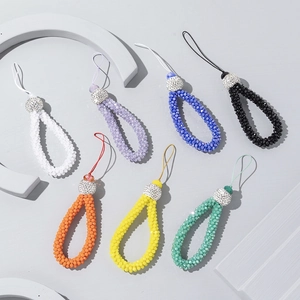 Set of seven colorful beaded phone wrist straps with sparkling rhinestone accent balls