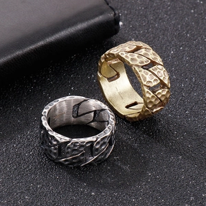 Retro stainless steel tire-pattern chain ring in silver and gold, 45-degree top view