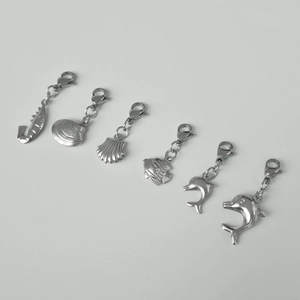 Detailed set of marine-themed stainless steel charms featuring seahorse and dolphin designs