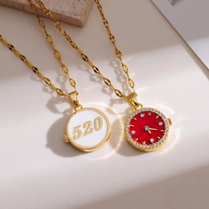 Detailed macro shot of the 520 round pendant and red watch-style necklace charm