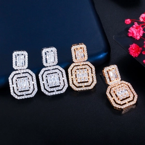 Elegant geometric double octagon earrings with crystals in gold and silver finishes