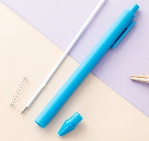 Detailed view of blue click ballpoint pen components, candy color plastic stationery item.