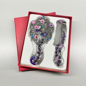 Vintage peacock mirror and comb set with colorful enamel in a red gift box