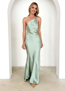 Detail of the light green satin dress featuring a one-shoulder neckline and elegant draping