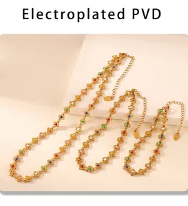 Detail of PVD plated stainless steel jewelry set with colorful flower charms
