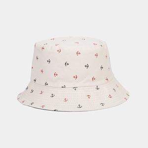 Detail of anchor print pattern and reinforced stitching on off-white bucket hat