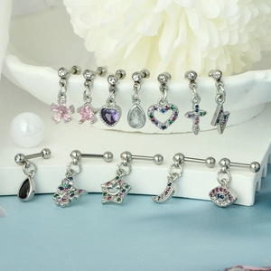 Macro detail of various stainless steel cartilage stud earrings with colorful cubic zirconia