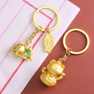 Lucky cat keychain set with matte gold finish and fish bone pendant charms