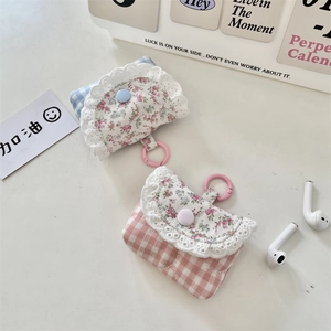 Detail of sweet floral lace earphone cases with plaid fabric and snap closure