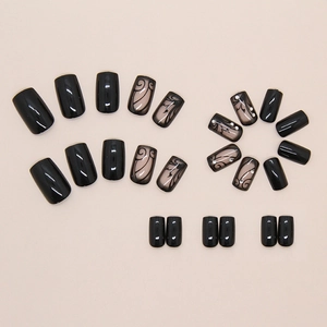 Detail of black baroque vine press-on nails with sparkling rhinestones and square tip
