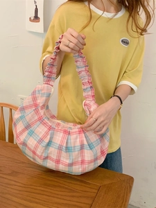 Pink and blue plaid pleated shoulder bag with a ruffled strap and crescent moon shape