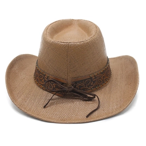 Detail of classic brown woven cowboy hat with floral embossed leather band and studs