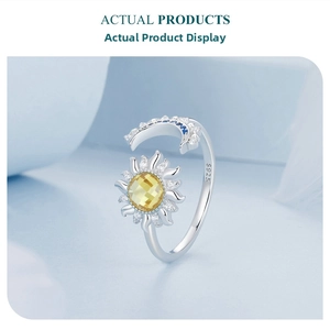 Close-up of S925 sterling silver sun and moon ring with yellow and blue gemstones