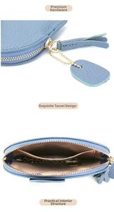 Blue leather elephant coin purse detail with gold hardware tassel and interior key chain