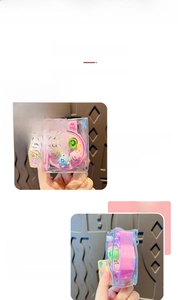 Close-up of pink rotating fishing game keychain with colorful small fish charms