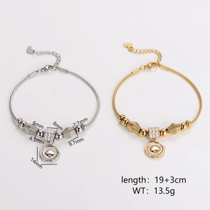 Snake chain charm bracelet with heart pendant in gold and silver finish on white background