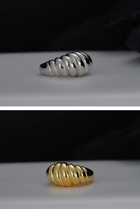 Close-up of S925 sterling silver croissant rings in both gold and silver polished finishes