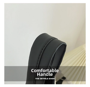 Close-up of durable black lychee grain leather handle with precise stitching detail