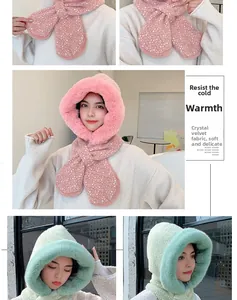 Detail of pink and green plush hooded scarf with white polka dots and soft velvet lining