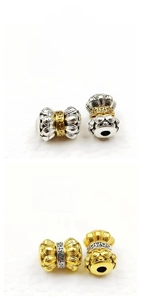 Macro detail of two-tone Tibetan silver barrel beads with 9mm diameter and 12mm height