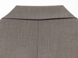 Detailed back neckline view of the grey-brown woven blazer showing seam craftsmanship