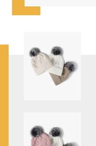 Detailliertes Zopfmuster an Wintermützen mit einem weichen grauen Kunstpelz-Bommel-Detail