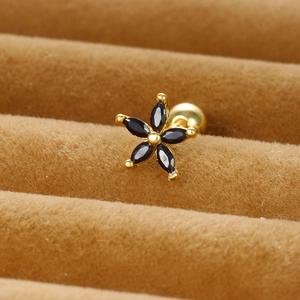 Macro shot of 925 silver flower stud earrings with marquise black stones and ball back