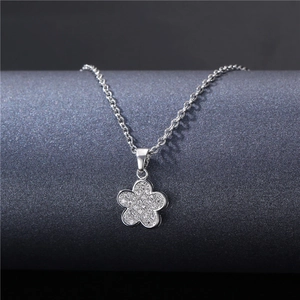 Elegant silver flower pendant necklace with shimmering zircon stones on an O-chain