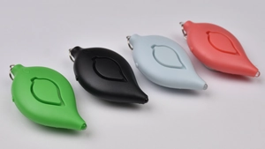 Leaf-shaped personal safety alarms in green, black, blue and red with keychain rings