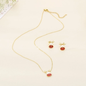 Detail of Christmas reindeer jewelry set with red and white enamel on golden chain