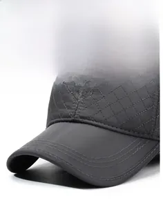 Detail of water-repellent quilted fabric and embroidery on dark grey baseball cap