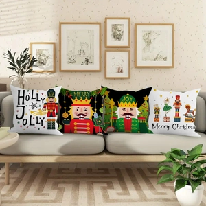 Set of four Christmas nutcracker decorative pillow covers on a cozy grey sofa
