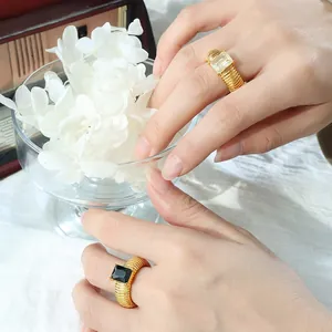 Retro titanium steel rings with ribbed bands and large rectangular glass stones