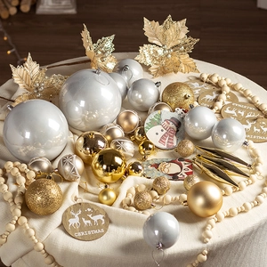 Golden and silver Christmas ornament set with glitter balls and decorative leaves