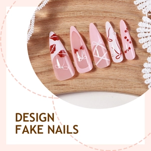 Pink stiletto press-on nails with red bow, lip prints and ribbon patterns