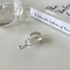 Macro shot of 925 sterling silver adjustable ring featuring minimalist geometric beads
