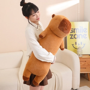 Macro view of long capybara plush pillow fabric texture and cute closed eyes facial detail