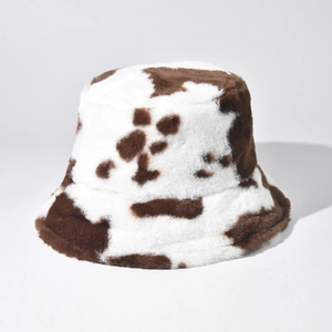 Winter brown and white cow pattern faux fur bucket hat for women with warm plush texture