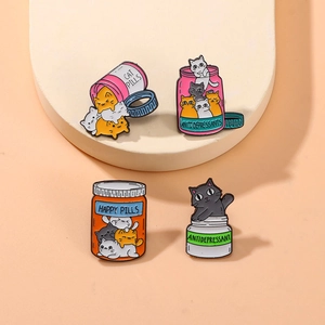 Set of four cute cartoon cat enamel pins in colorful pill bottle shapes with HAPPY text