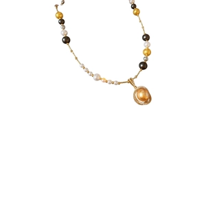 French vintage gold pearl necklace with zircon oval pendant on white background