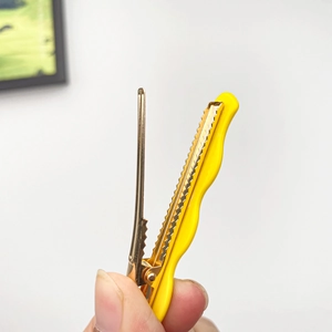 Wavy yellow macaron acetate hair clip with golden metal duckbill clip for women