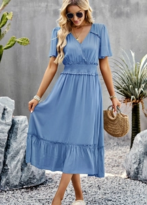 Detail view of blue V-neck dress featuring short sleeves and elastic pleated waist