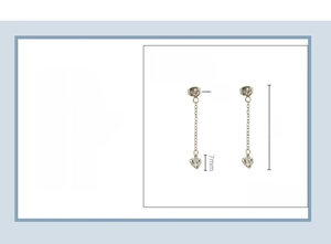 Detail view of heart-shaped tassel earrings in stainless steel with 4cm length and zircon